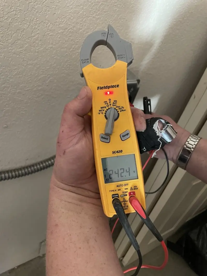 Voltage testing with clamp meter during Outlet Installation in Woodburn